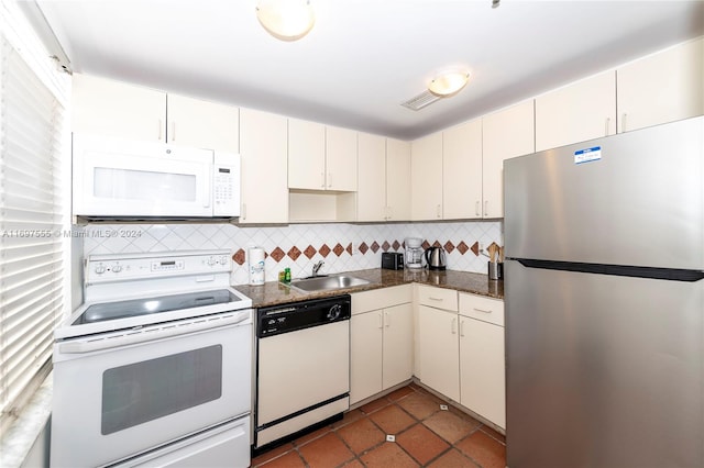 kitchen featuring decorative backsplash, white appliances, white cabinetry, and sink