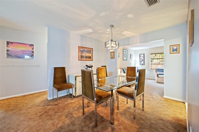 carpeted dining area with a textured ceiling and a chandelier