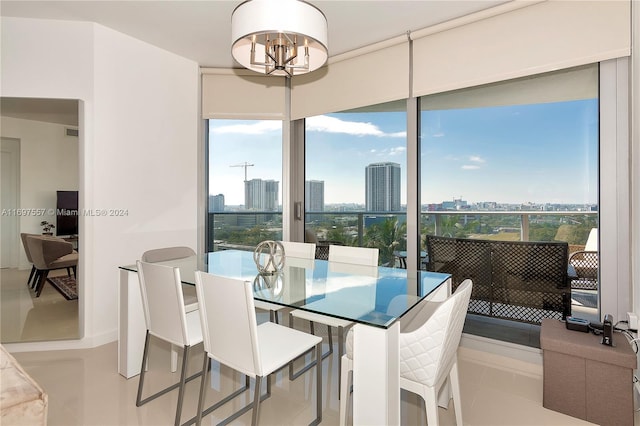 tiled dining space with a notable chandelier