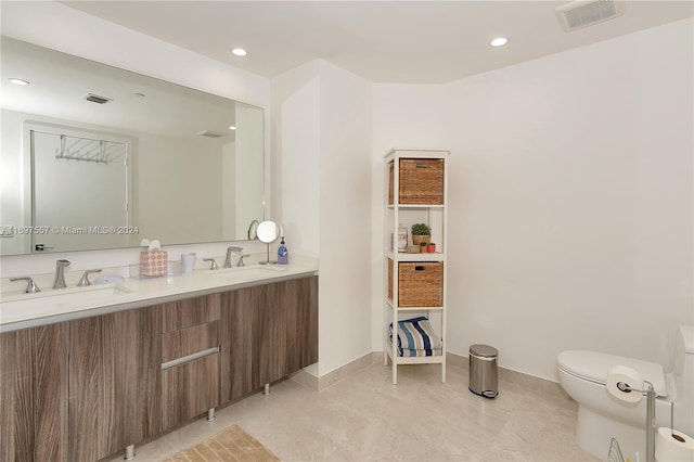488 NE 18th St Unit 1700, Miami, FL 33132 - bathroom with double vanity, toilet, recessed lighting, and baseboards