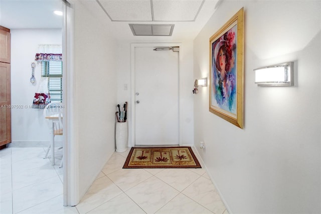 doorway with light tile patterned flooring