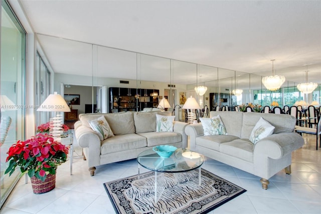 tiled living room featuring an inviting chandelier