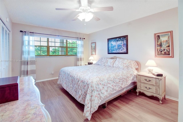 bedroom featuring ceiling fan and wood-type flooring