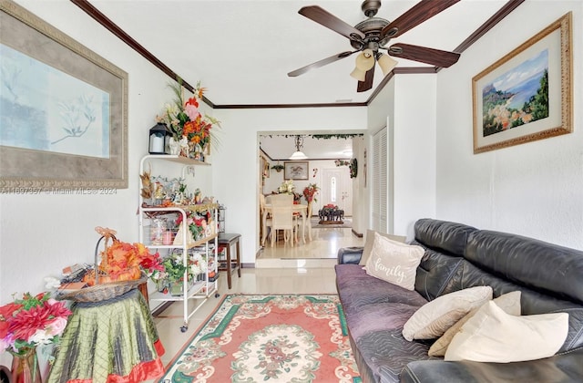 living room with ceiling fan and crown molding