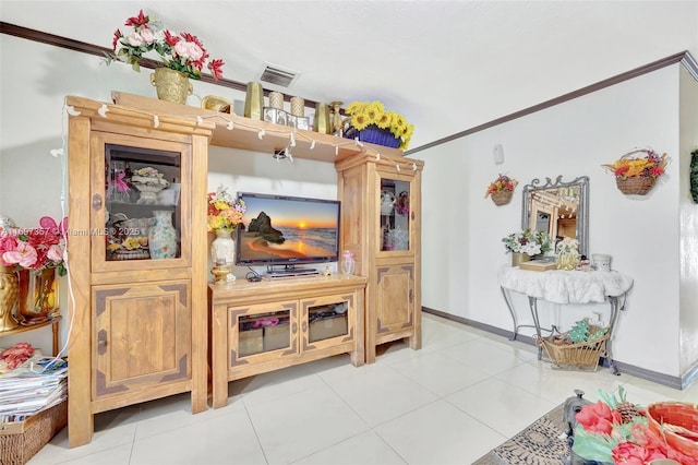 living room with light tile patterned floors and ornamental molding