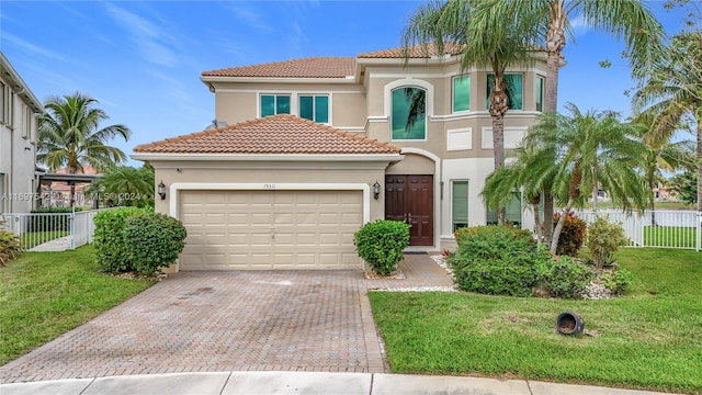 mediterranean / spanish house with a front yard