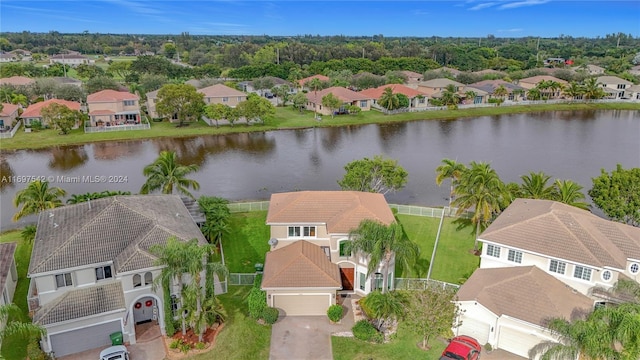 birds eye view of property with a water view