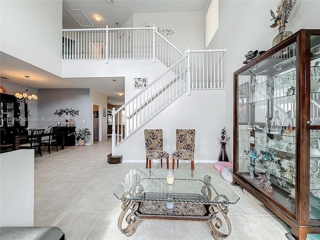 interior space with a notable chandelier and a high ceiling