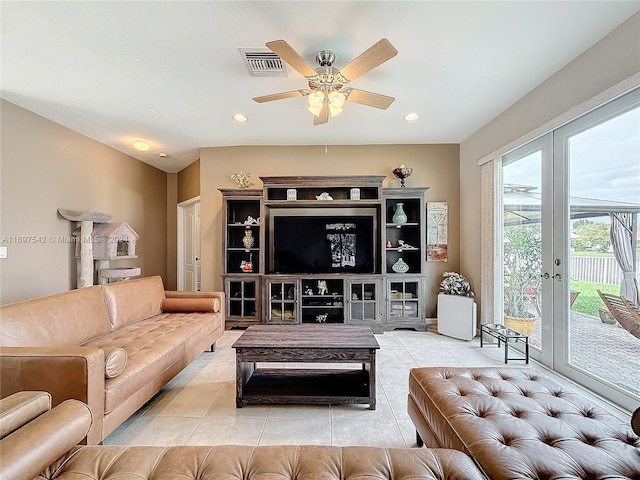 living room with ceiling fan, french doors, and light tile patterned flooring