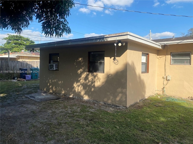 view of side of property with a yard