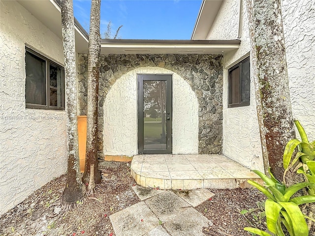 5210 SW 186th Ave, Southwest Ranches, FL 33332 - doorway to property featuring stucco siding and stone siding