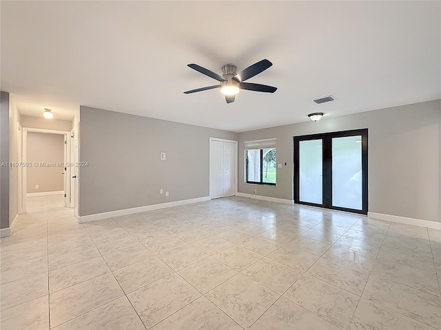 empty room featuring ceiling fan