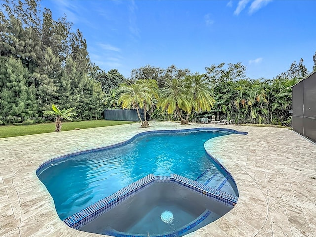 view of pool featuring an in ground hot tub and a patio