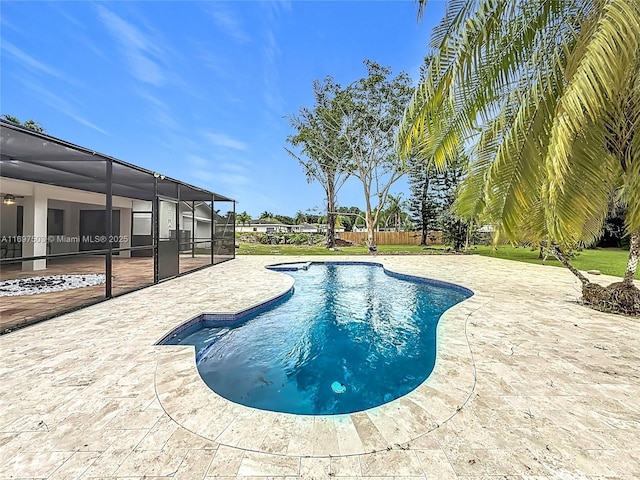 5210 SW 186th Ave, Southwest Ranches, FL 33332 - outdoor pool featuring a patio, glass enclosure, and a ceiling fan