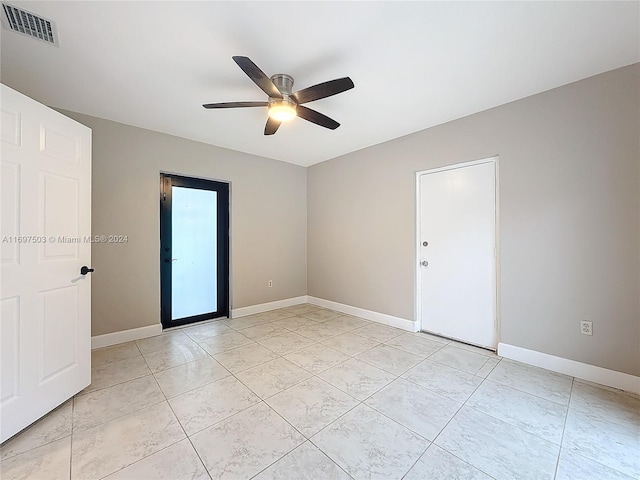 spare room featuring ceiling fan