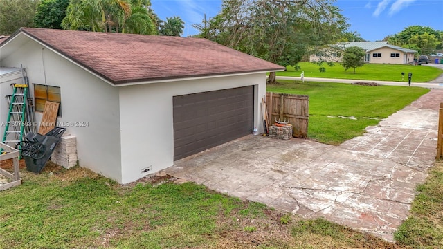 garage with a yard