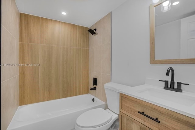 full bathroom featuring vanity, toilet, and tiled shower / bath