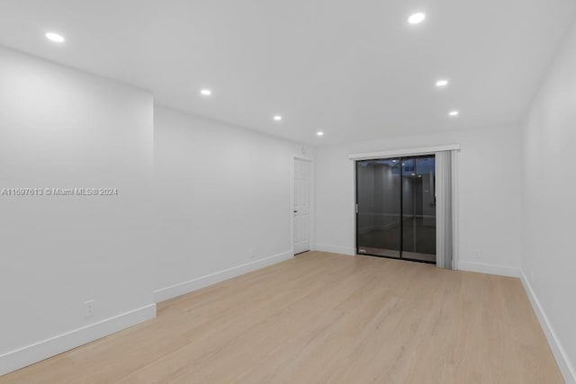 spare room featuring light hardwood / wood-style flooring