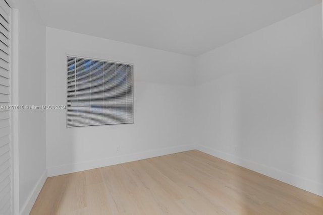 spare room with light hardwood / wood-style floors