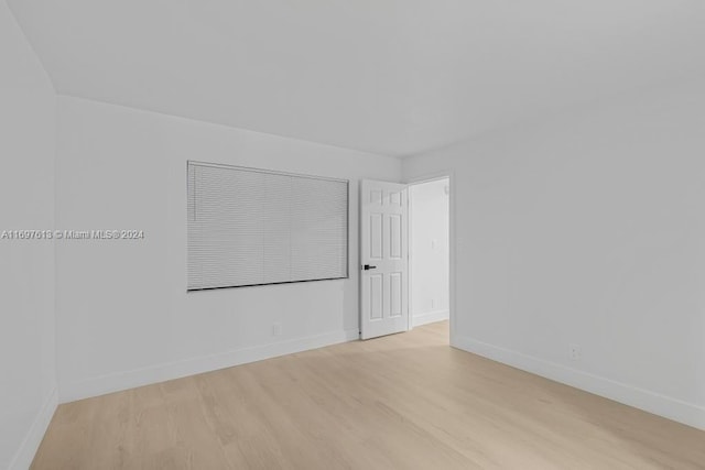 spare room featuring light hardwood / wood-style flooring