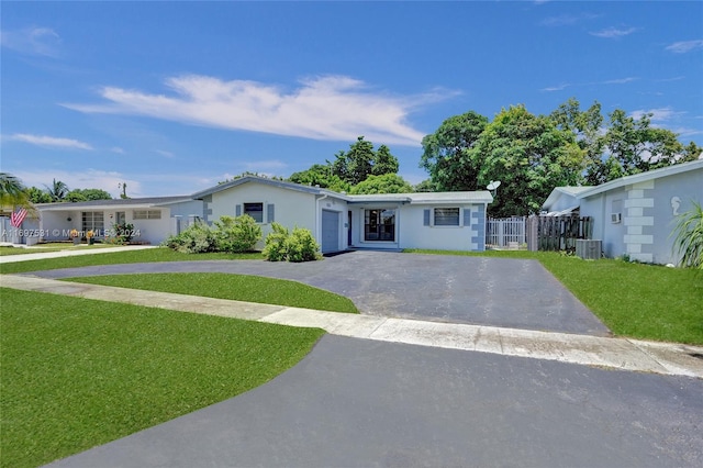 ranch-style home with a front lawn