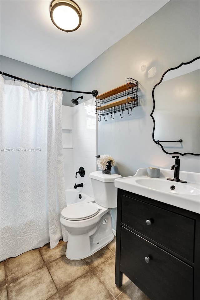 full bathroom featuring tile patterned flooring, vanity, toilet, and shower / bath combo