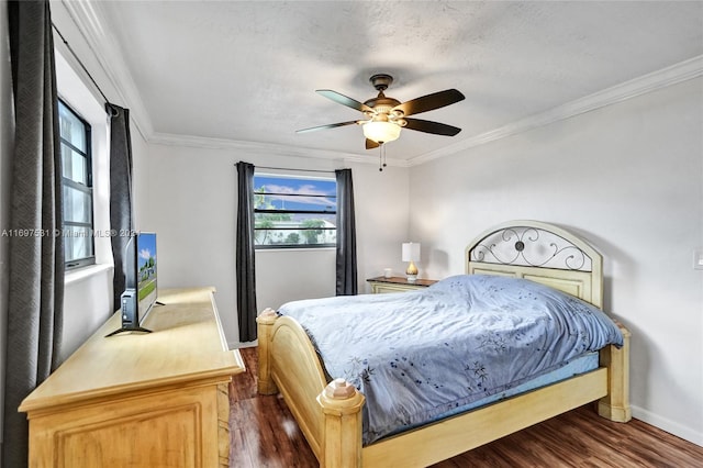 bedroom featuring multiple windows, ceiling fan, and dark hardwood / wood-style floors