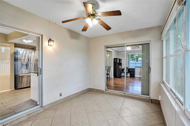 unfurnished room with ceiling fan and light hardwood / wood-style flooring