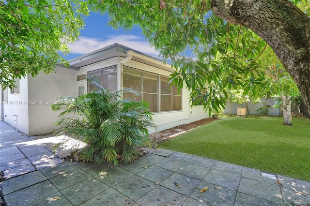 view of home's exterior featuring a yard