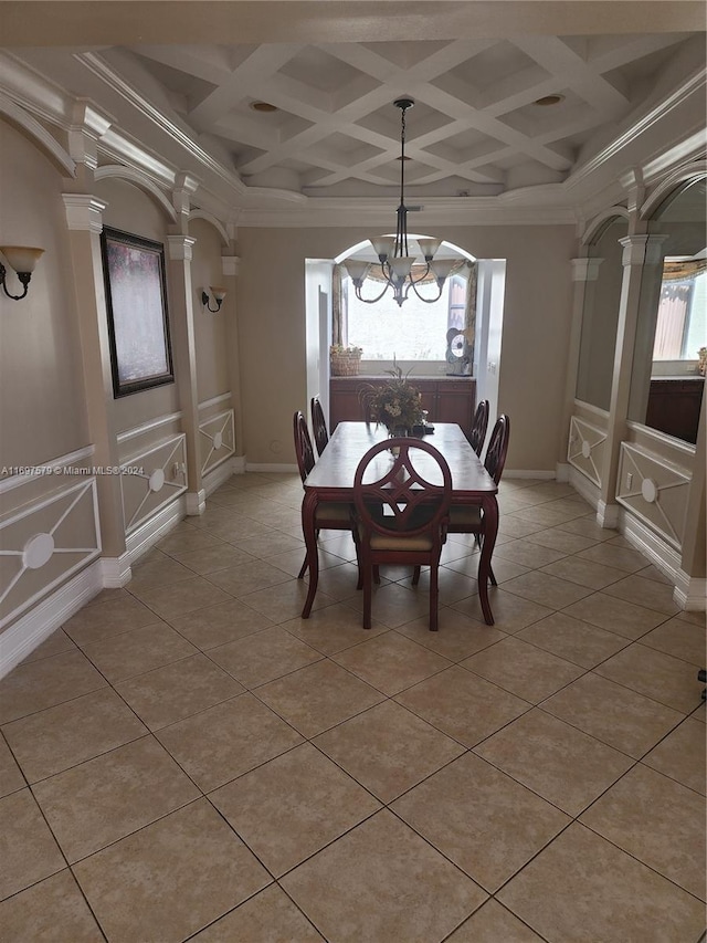 unfurnished dining area with plenty of natural light, coffered ceiling, and a notable chandelier