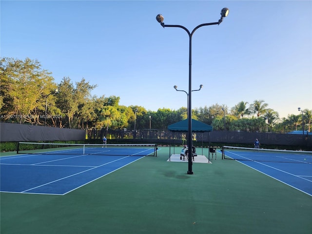 view of tennis court with basketball court