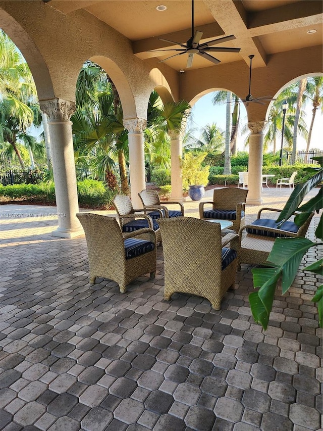 view of patio / terrace with ceiling fan and an outdoor living space