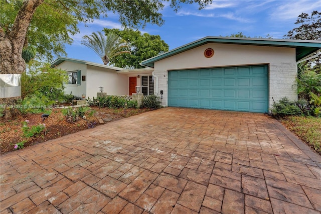 single story home featuring a garage