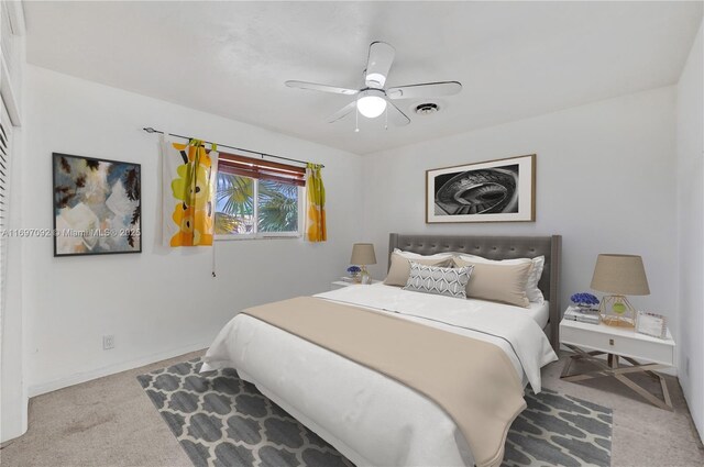 carpeted bedroom featuring ceiling fan