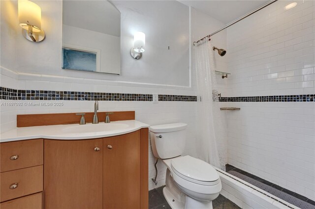 full bathroom featuring tile patterned floors, toilet, tile walls, vanity, and shower / bath combination with curtain