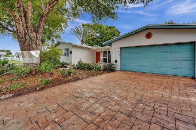 single story home with a garage