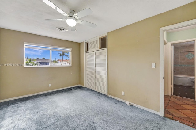 unfurnished bedroom with a closet, ceiling fan, and carpet