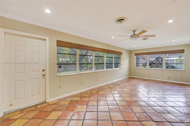 entrance foyer with crown molding, light tile patterned floors, and ceiling fan