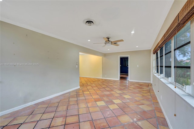 spare room featuring crown molding, light tile patterned floors, and ceiling fan