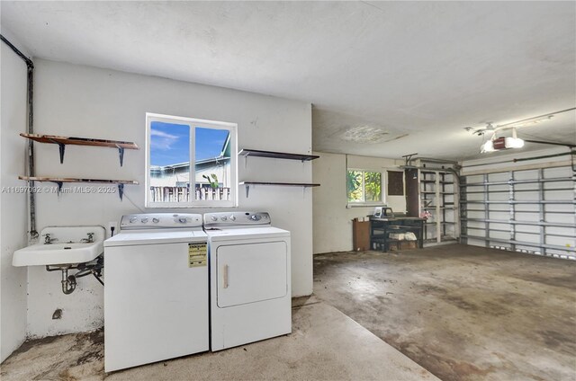 laundry room featuring sink and washing machine and clothes dryer