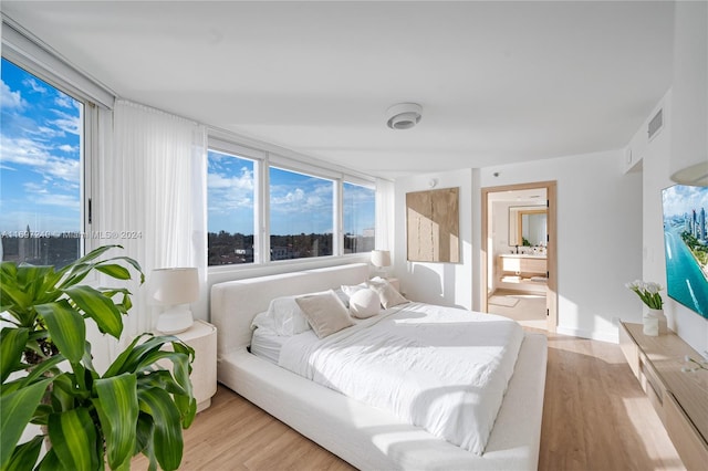 bedroom featuring light wood-type flooring