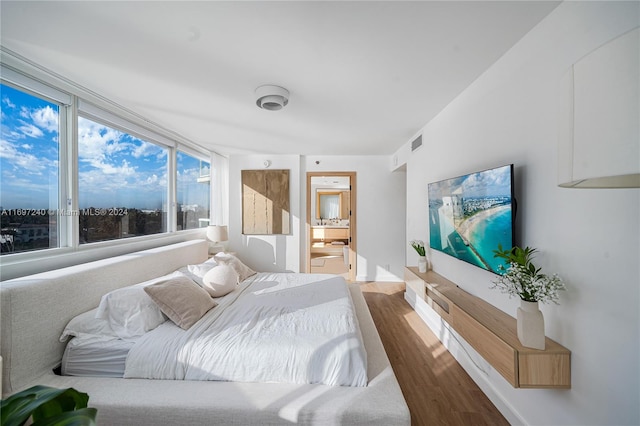 bedroom with wood-type flooring