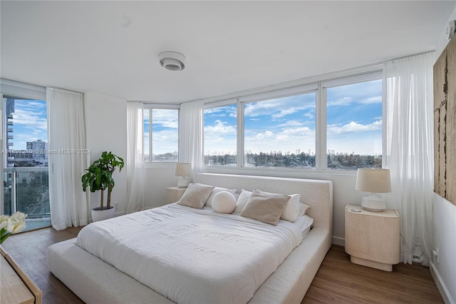 bedroom with wood-type flooring