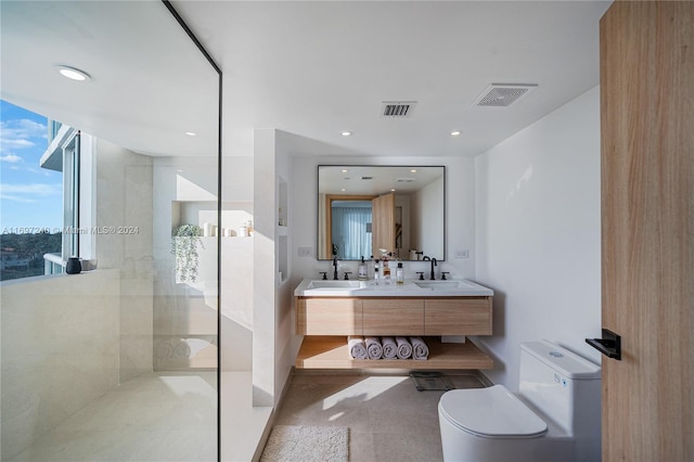 bathroom with vanity, toilet, and walk in shower