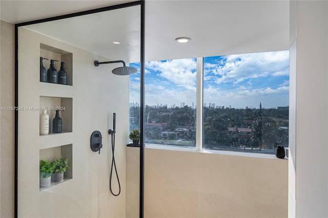 bathroom with tiled shower