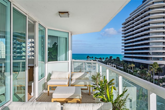 balcony featuring a water view