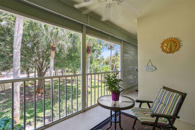 sunroom featuring ceiling fan and a healthy amount of sunlight