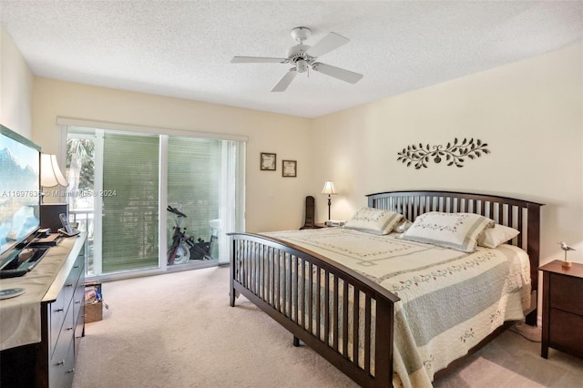 bedroom featuring access to outside, ceiling fan, light carpet, and a textured ceiling