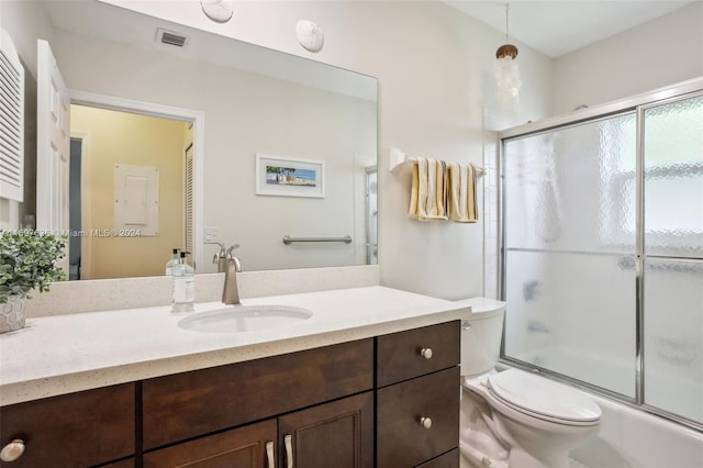 full bathroom with shower / bath combination with glass door, vanity, and toilet