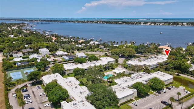 birds eye view of property with a water view